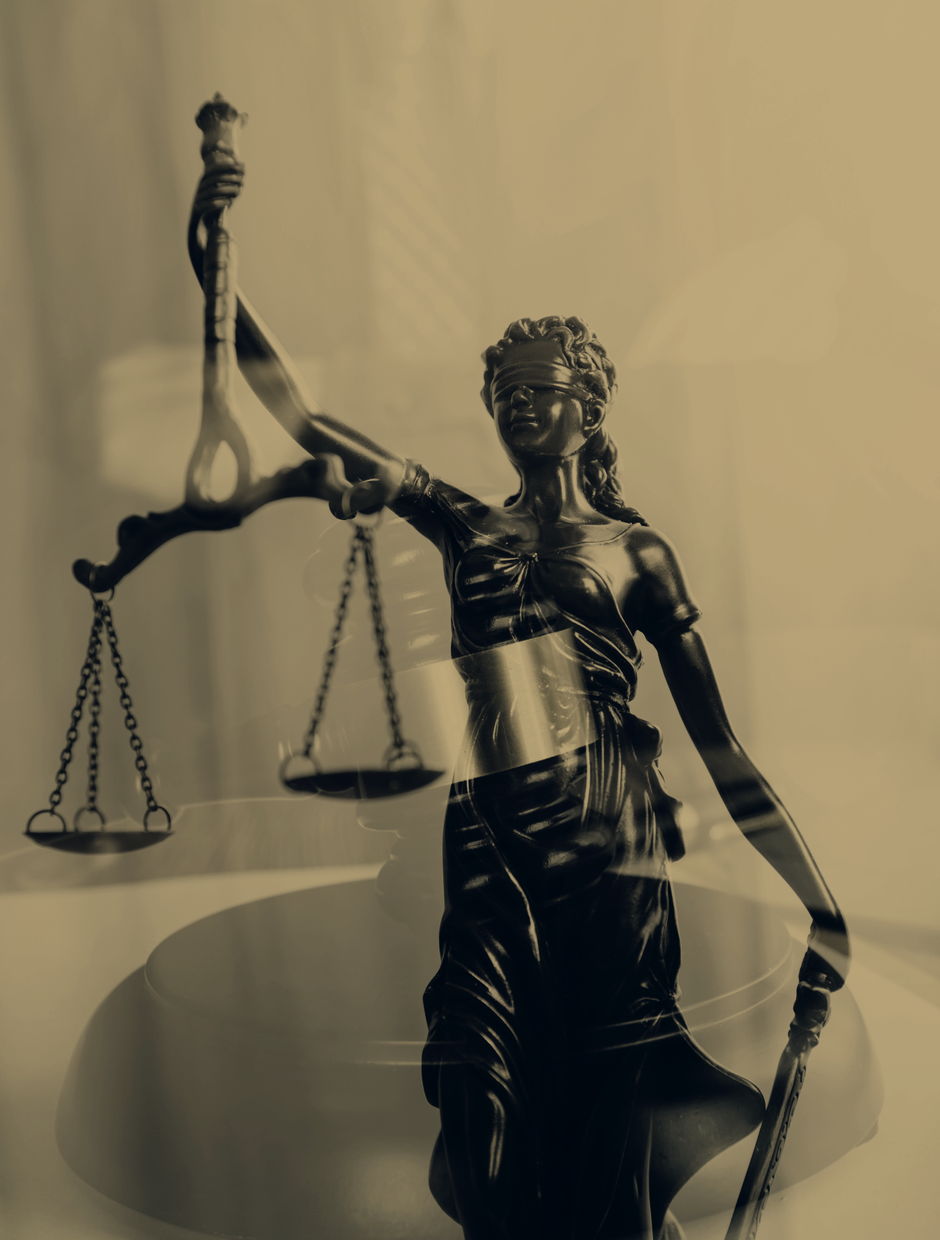 Bronze statue of Lady Justice holding scales
